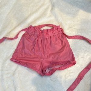 Pink leather shorts